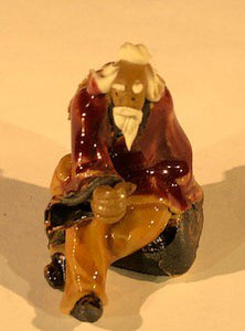 Miniature Ceramic Figurine<br><i></i>Man Sitting on Bench<br>2"